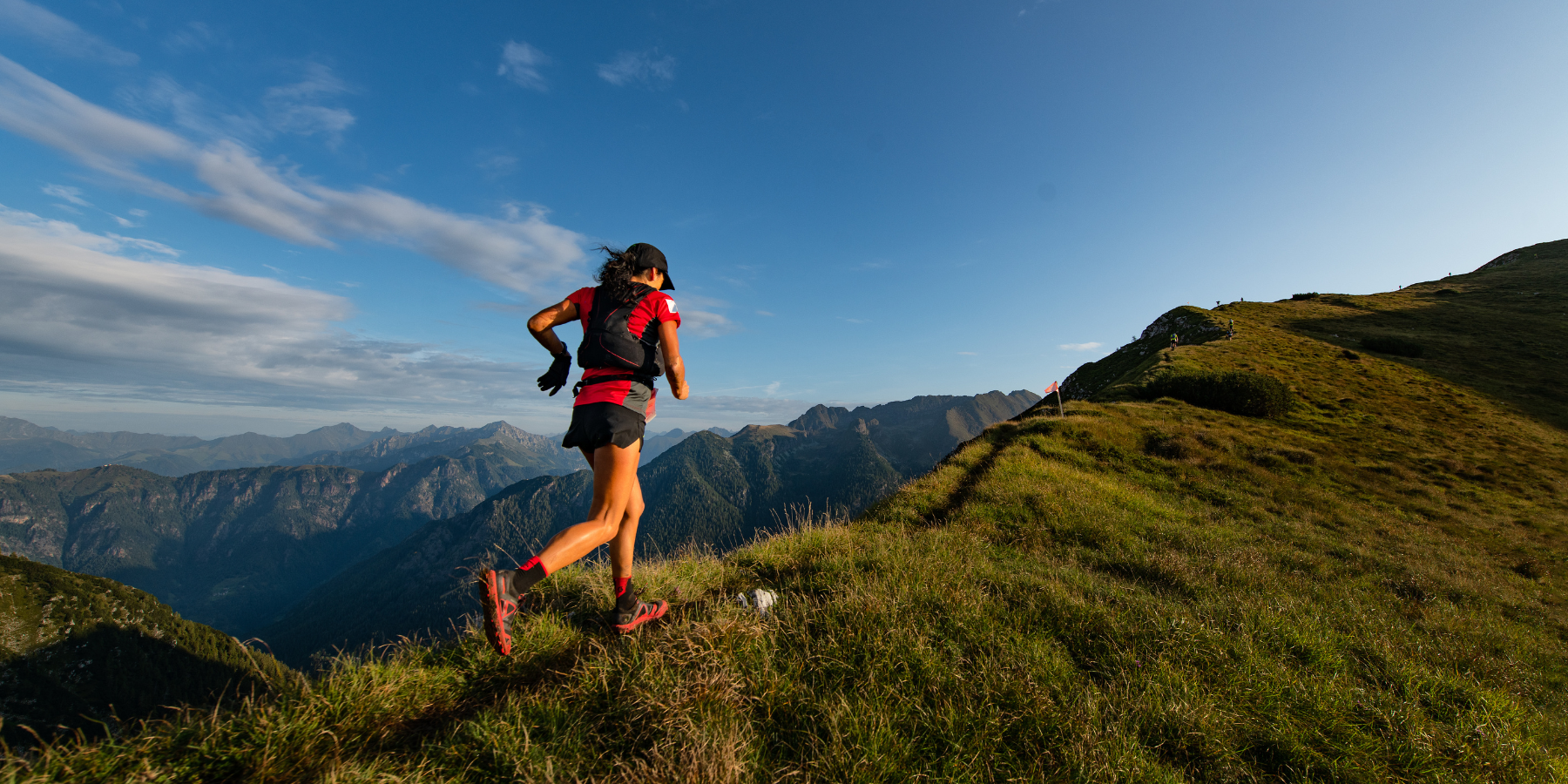 Woman trail running in the mountains