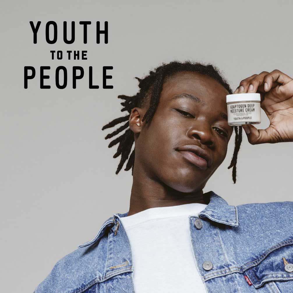 Man holding container of a skin care product with Youth to the People logo