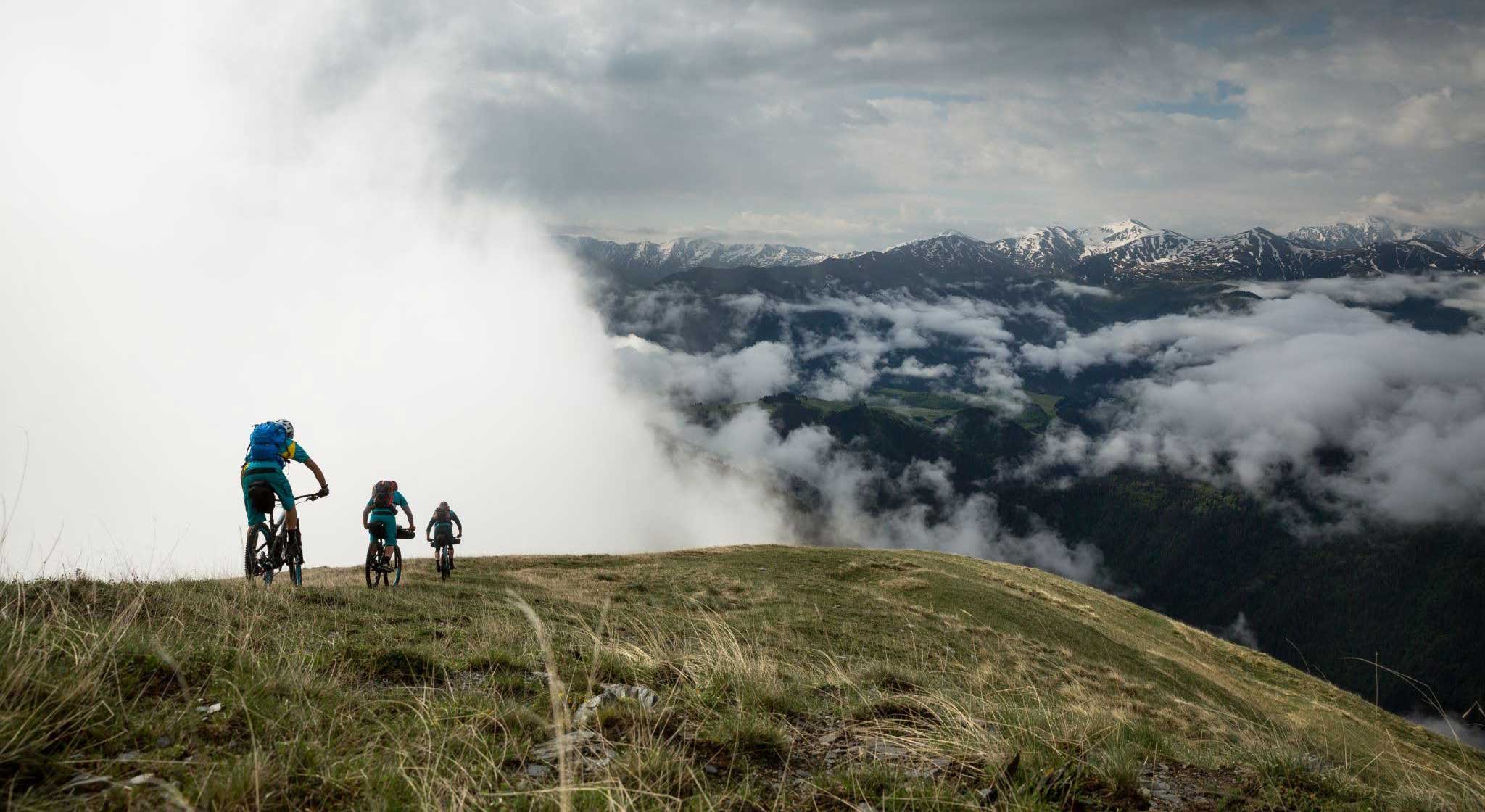 People mountain biking