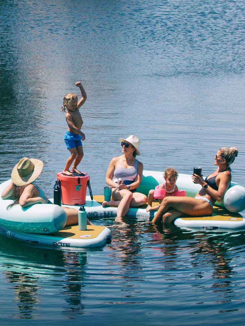 Family sitting on a floating lounger