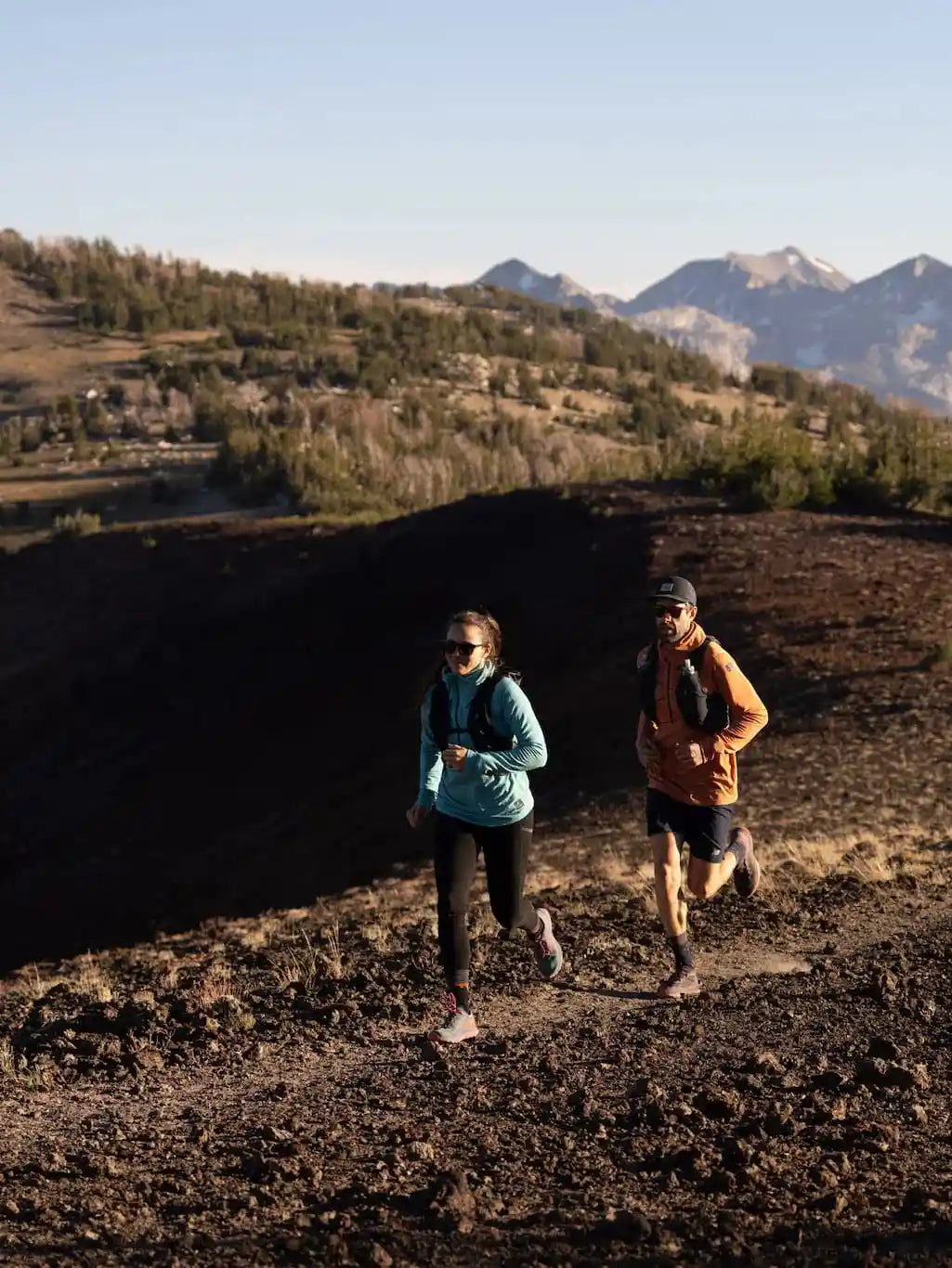 Woman and man trail running