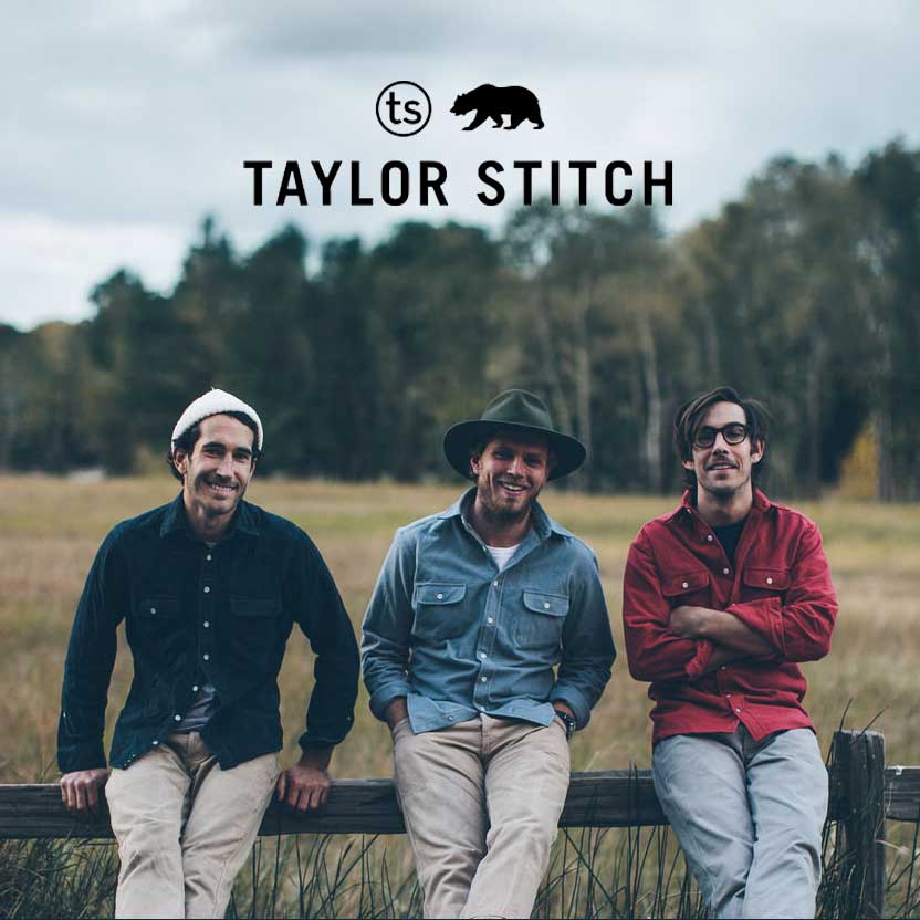 Three men sitting on a fence with Taylor Stitch logo